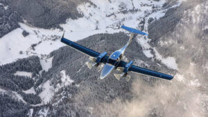 Plane Flying Above Mountains 300x169